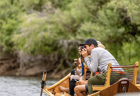people in a boat on a lake