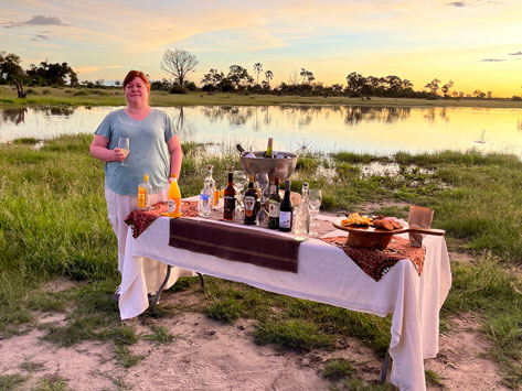 Kasey Nooris having sundowners in Africa.