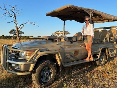 Siobhan on a vehicle in Africa.