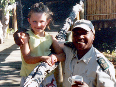 Alex Tett with a guide in Africa when she was a child.