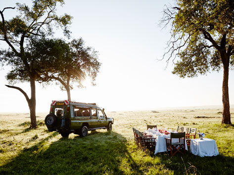 A safari vehicle with outdoor dining.