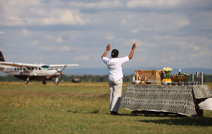 A staff member greeting clients as they land in Africa.