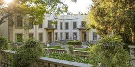 Grand colonial courtyard and gardens at golden hour at Fairlawns Boutique Hotel and Spa, Johannesburg, South Africa