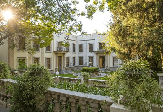 Grand colonial courtyard and gardens at golden hour at Fairlawns Boutique Hotel and Spa, Johannesburg, South Africa