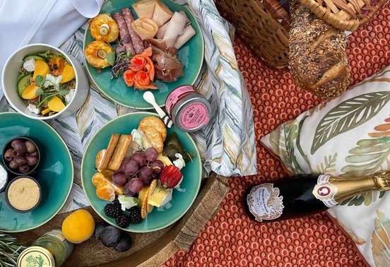 Luxury picnic spread with charcuterie, fruit, cheese and champagne at Fairlawns Boutique Hotel and Spa, Johannesburg