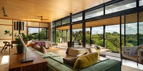 Open-plan luxury suite living area with bush views and private pool deck at Tanda Tula Safari Camp, Timbavati