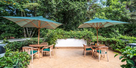 The pool sitting area at the House of Waine.