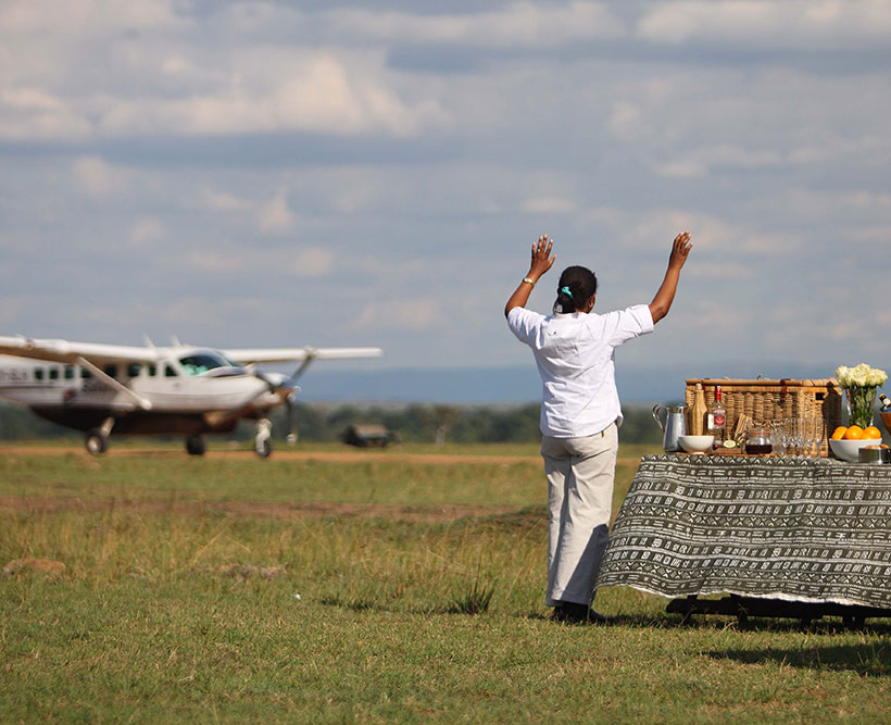 Greeting passengers landing on the runway in Africa.