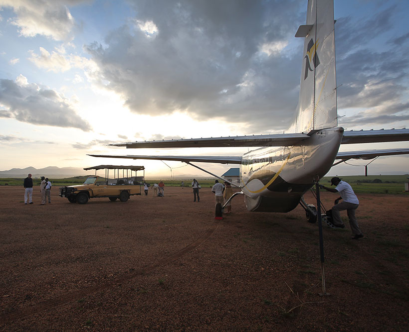 Crews loading a Cessna in Uganda.