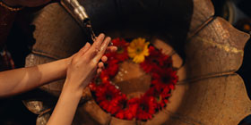 A woman washing hands at the Darwika Hotel
