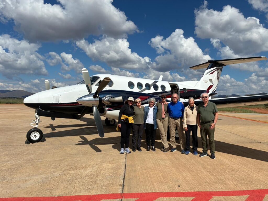 Bushracks Travelers next to a King Air 200.