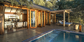 Private House at Tongabezi Lodge featuring an open-air living area and plunge pool overlooking the Zambezi River.