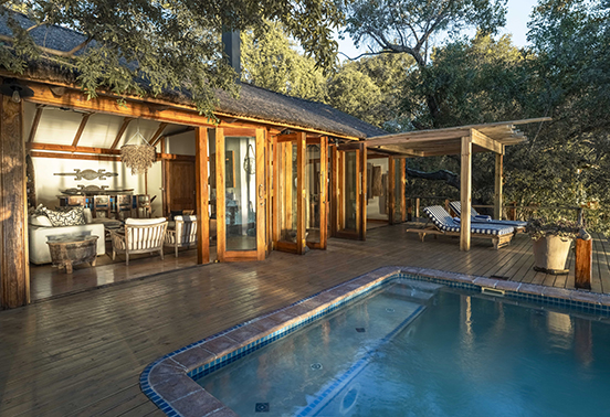 Private House at Tongabezi Lodge featuring an open-air living area and plunge pool overlooking the Zambezi River.