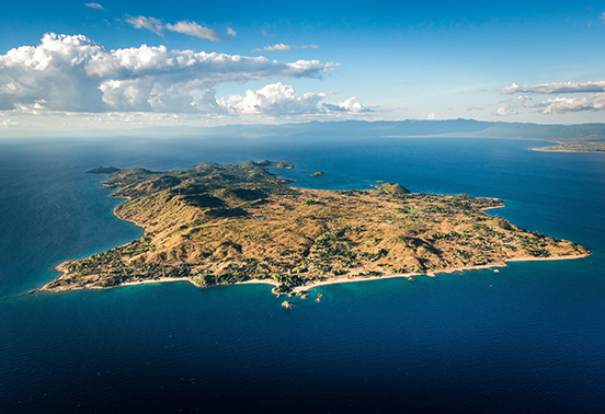 Aerial view of Likoma Island surrounded by the deep blue waters of Lake Malawi, home to Kaya Mawa lodge.